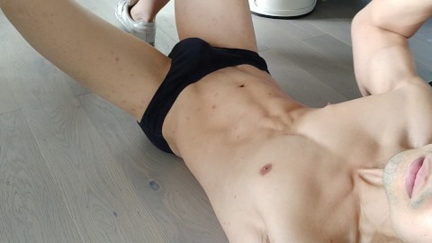 Horny stud flexes his muscles before a nice hands free load over his abs